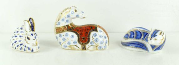 Three Royal Crown Derby animal paperweights, comprising horse lying down, circa 1991, with silver