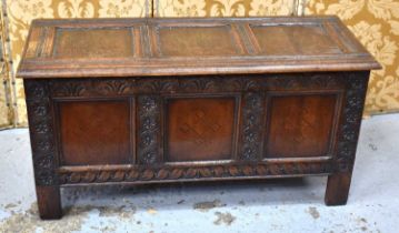 A late 17th / early 18th century oak coffer, carved three panel front having surrounded by