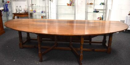 A large oak drop leaf table in the refectory style, 336cm by 200cm.