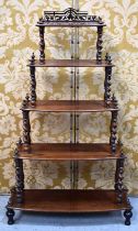 A 19th century rosewood whatnot composed of five graduated shelves united by barley twist