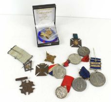 A group of medal and medallions to include Masonic jewel, silver religious medal, Queen Victoria