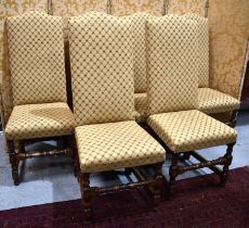 A set of six oak dining chairs with tall camel backs, upholstered to the back and seats.