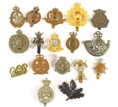 A group of military cap badges including Scottish Rifles, 25th Dragoons, 12th Royal Lancers, Royal