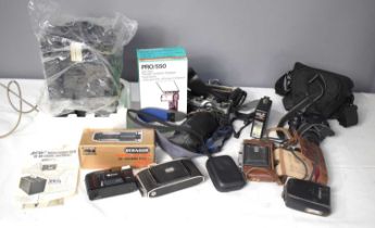 A group of cameras and accessories to include a Pentax Spotmatic 35mm camera with zoom lens, Agfa