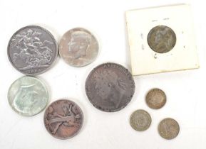 A group of silver coins to include a George III crown dated 1821, Queen Victoria crown dated 1896,