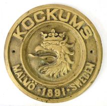 A Swedish brass ships builders plaque, inscribed Kockums Malmo 1891, 29cm diameter.