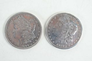 Two USA silver dollars, one dated 1888 the other 1921.