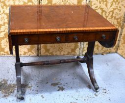 A Edwardian mahogany drop leaf sofa table, the table raised on splayed legs with a turned central