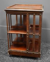 A small antique mahogany revolving bookcase, 60cms tall by 40cms square