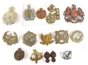 A group of military cap badges to include Royal Engineers, Kings Liverpool regiment, Home Counties