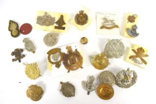 A group of regimental cap badges, including the 3rd Kings Own Hussars, Motor Machine Gun Service,