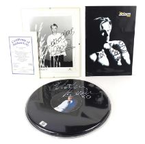 A Justin Bieber signed 12" drum head with certificate together with two Adam Rickett autographs.