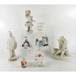 A group of 19th century porcelain, including a figure of a Child proffering a pansy, a figure of