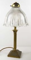 An Edwardian brass stick table lamp, with fluted glass shade, 42cm high.