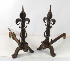 A pair of French cast and wrought iron fire dogs and andirons.