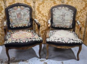 A pair of French Louis XV style armchairs, with needlepoint upholstery, the seats depicting birds