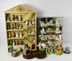 A Franklin Mint 'The Woodhouse Family' collection, including the wall display rack and figurines