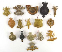 A collection of military badges to include Royal Bucks Hussars, 3rd Dragoon Guards arm badge, 1st