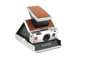 A vintage Polaroid SX-70 land camera.