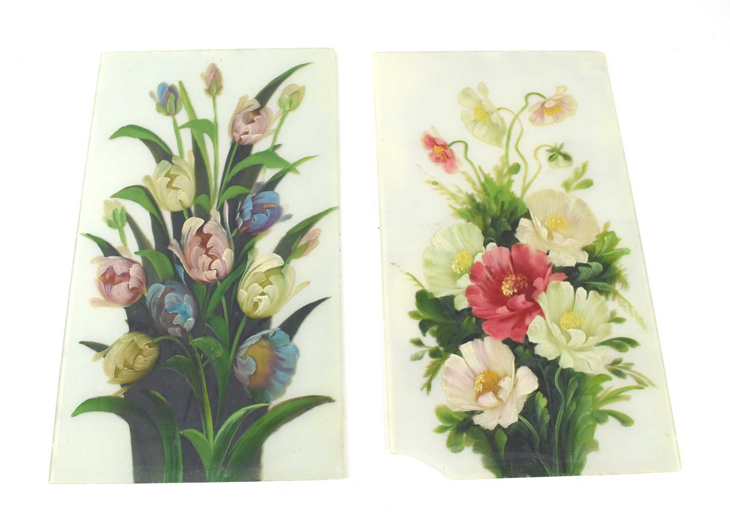Two hand painted floral glass panels, one painted with tulips, the other with poppies and anenomies,
