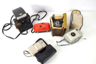A group of cameras to include Gnome Baby Pixie, Polaroid 5000 Land Camera and others.