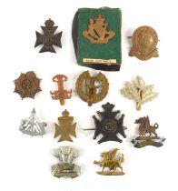 A group of military cap badges to include Leicestershire Yeomanry South Africa 1900-02, North