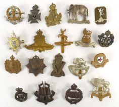 A group of military cap badges to include Herefordshire Regiment, Irish Rifles, 19th Hussars,