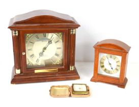 A Bulova quartz mantle clock, Westminster chime, together with a Seiko mantle clock and a Swiza