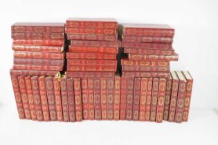 A set of fifty two Heron Collection Dennis Wheatley novels, gilt tooled red leather, 8vo.