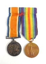 A group of two WWI medals awarded to PTE J. Canham, Bedf.R. number 19737, comprising the Victory