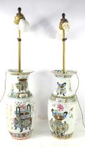 A pair of 19th century Chinese vases, converted to lamps, the enamel decoration depicting flowers,