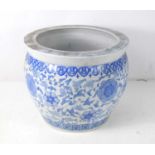 A 20th century Chinese blue and white jardiniere, decorated with flowers, 26.5cm high. [