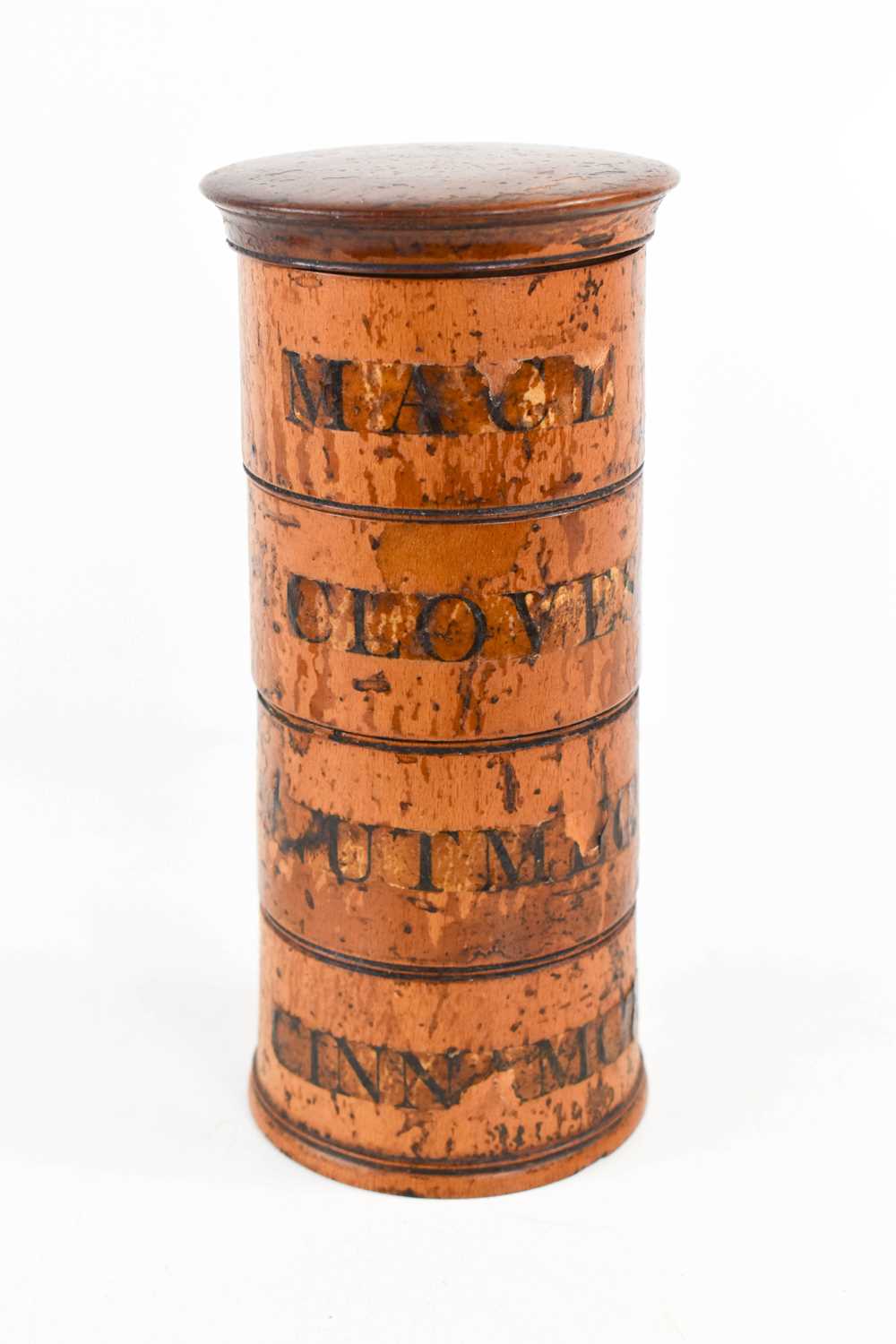 A 19th century treen spice box, composed of four tiers each labelled; Mace, Cloves, Nutmeg,