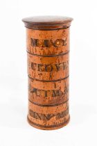 A 19th century treen spice box, composed of four tiers each labelled; Mace, Cloves, Nutmeg,