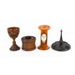 A group of 19th century treen to include an inkwell, carved all over with repeating spirals to the