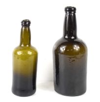 A George III olive green glass wine bottle with kick up base, 24.5cm, together with a half size