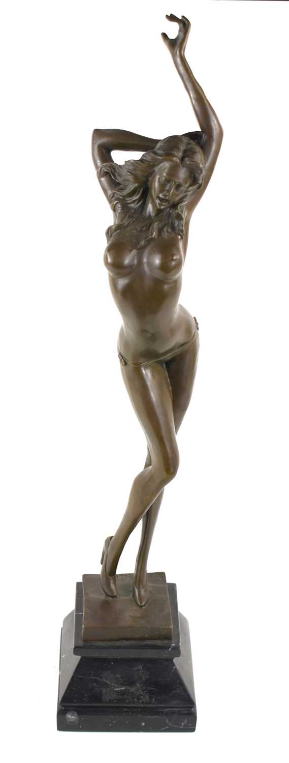 After Alda Vitaleh (20th century): a bronze semi-nude female, modelled in stilettos with one arm