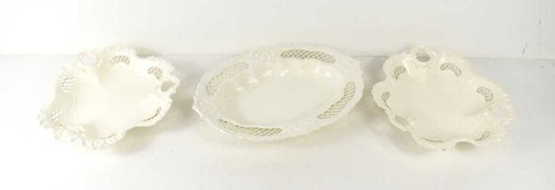 Three Victorian creamware dishes with pierced decoration, the largest measuring 29cm by 20.5cm.