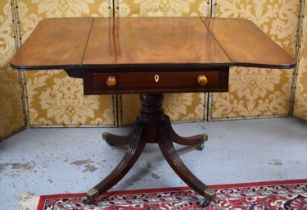 A 19th century mahogany pembroke table with two drop leaves, single drawer, raised on reeded legs