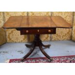 A 19th century mahogany pembroke table with two drop leaves, single drawer, raised on reeded legs