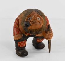 A Norwegian hand carved troll, in the style of Anton Sveen, carved from silver birch, painted in