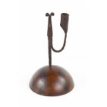 A treen and wrought iron early 19th century rushnip, the candle socket and nip raised on a domed