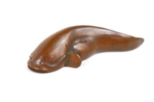 A small Japanese bronze model of a catfish, signed to the base, 5.5cm.