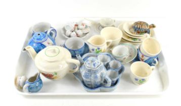 A group of miniature tea sets together with a small Chinese teapot, Wade tortoise and other