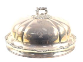 A large oval silver plated cloche, engraved wolf crest with Virtus in Ardius motto, with acanthus