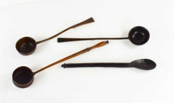 A selection of 19th century treen to include three punch ladles, and a rustic ebony carved spoon,