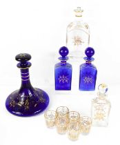 A Victorian cobalt blue glass ships decanter, a similar pair of bottles with stoppers, two glass