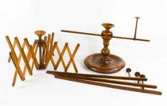 Two 19th century treen wool winders / swifts, one with four scissor action retractable arms, the