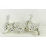 A pair of blanc de chine putti figurines, pushing leaf form wheel barrows, likely Triebner Ens &