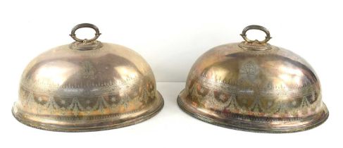 Two 19th century Elkington silver plated food covers, engraved with garlands and geometric patterned
